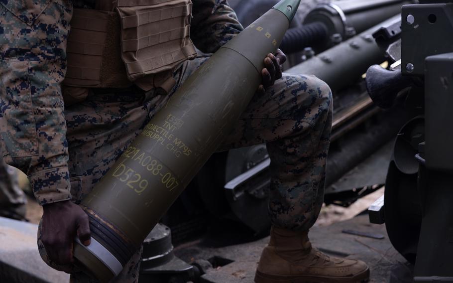 U.S. Marine Corps Lance Cpl. Folorunso Abdul, a field artillery cannoneer with 1st Battalion, 10th Marine Regiment, 2nd Marine Division, prepares to load an M777 towed 155mm howitzer during exercise Rolling Thunder on Fort Liberty, N.C., Oct. 16, 2023. 