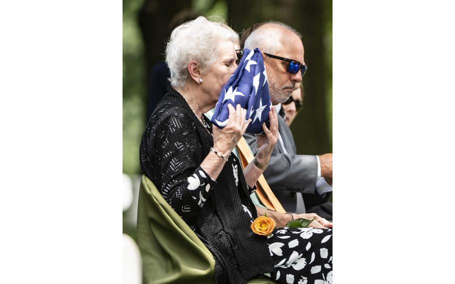 Sandra Sharpe kisses the U.S. flag from the funeral service for Sharpe’s grandfather, Marine Corps Maj. Gen. Harry Pickett, at Arlington National Cemetery, Arlington, Va., July 19, 2023.