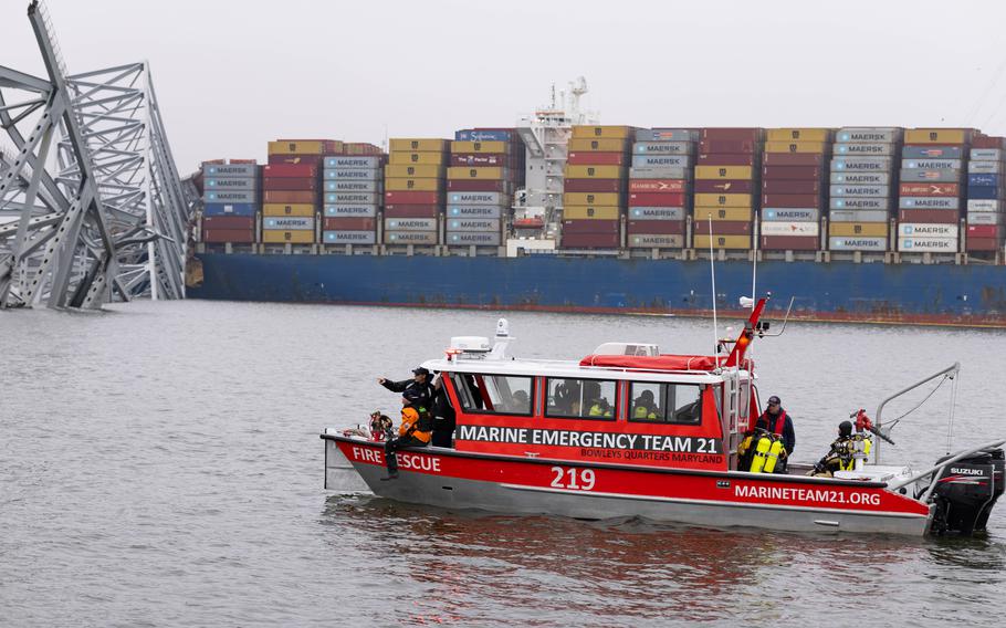 Forensic operations technicians from various state and federal agencies assist in analyzing data acquired from the U.S. Army Corps of Engineers survey boat the Catlett in the Baltimore Harbor on March 27, 2024. They were using sonar equipment to determine the location of debris and search for submerged vehicles.