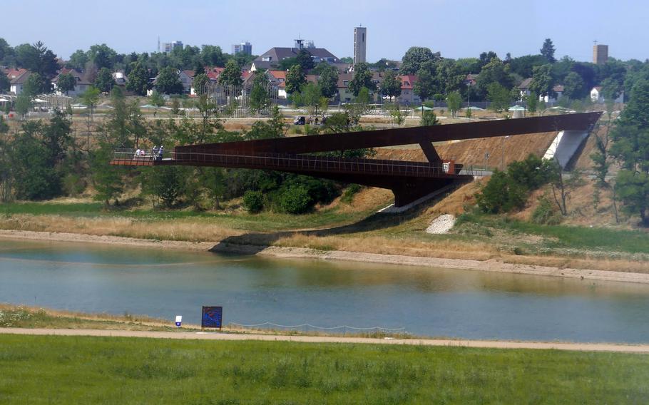 The Panoramasteg, or panorama walkway, seen from the BUGA cable car. It is a 143-foot long footbridge over the Augewaesser, a small lake. After the horticultural show ends Oct. 8, 2023, the bridge is to be expanded over the lake, to connect the nature preserve there with the one that was once the U.S. Army’s Spinelli Barracks.