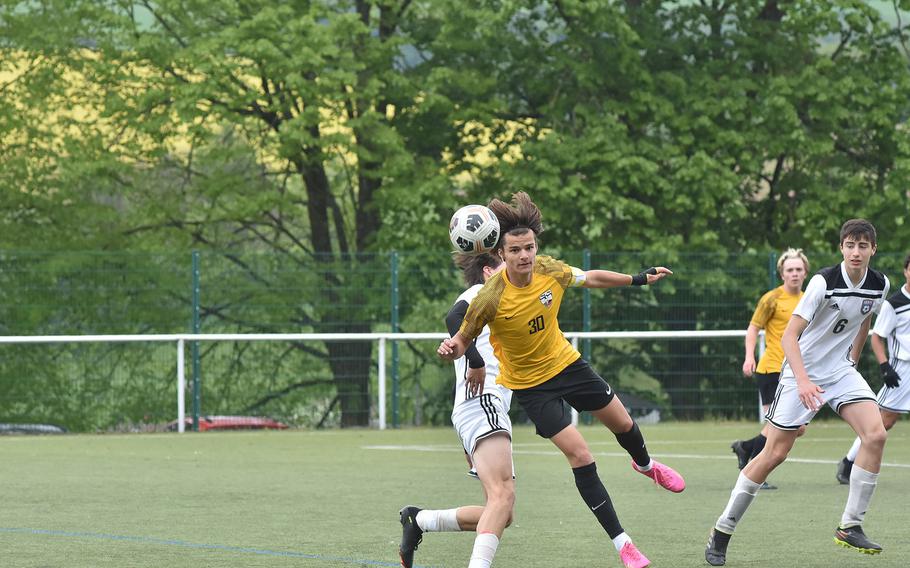 Stuttgart's Itzak Sandoval heads the ball away from SHAPE in the Panthers' 2-1 overtime victory of the Spartans on Wednesday, May 17, 2023, in the semifinals of the DODEA-Europe Division I boys soccer championships.