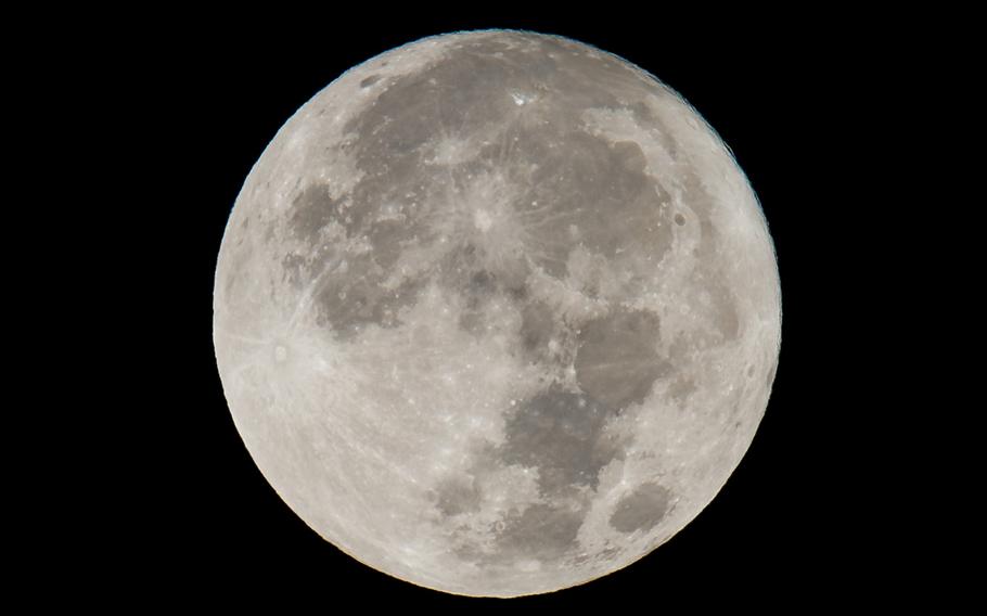 The moon, or supermoon, is seen as it sets over Washington on Monday, Nov. 14, 2016. While its impacts on the tide are known, the moon’s many phases might also influence the creatures that swim within such as sharks, according to new research.