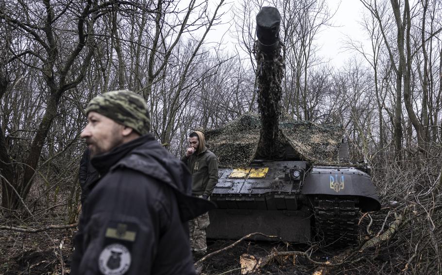 Ukraine military mechanics work on a Soviet-era T-72 tank captured from the Russians in the Donetsk region of eastern Ukraine on March 19, 2023.