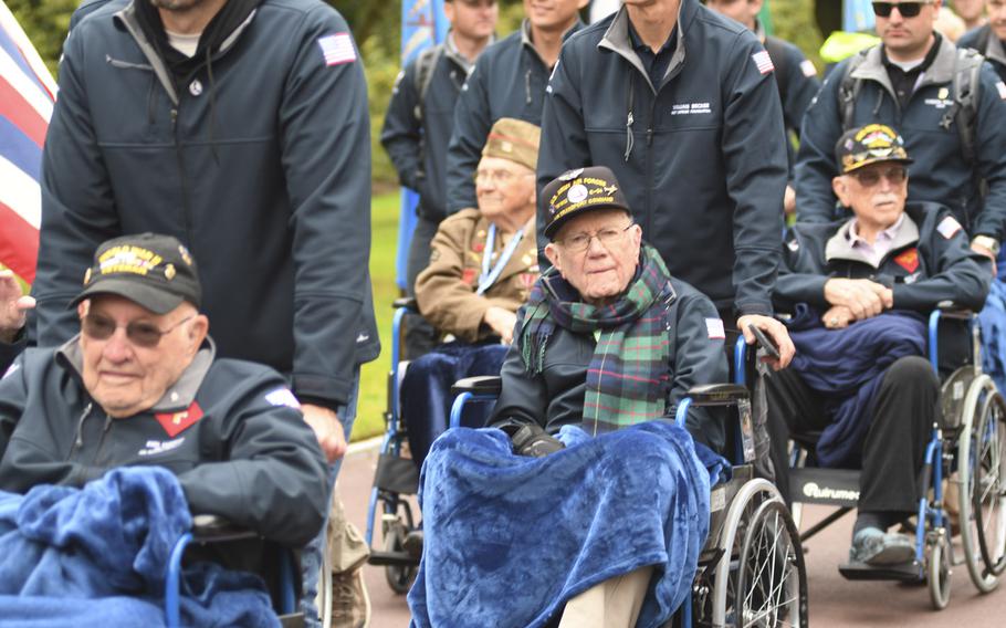 Veterans from World War II braved the chilly, windy air along the northern French coastline to salute their fallen comrades on Tuesday, June 6, 2023, the 79th anniversary of the D-Day invasion.
