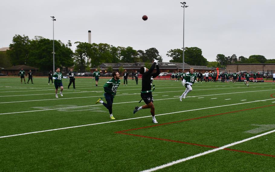 U.S. Air Forces Tech Sgt. Javaris Samuels, from the 495th Aircraft Maintenance Unit, catches a 30-yard pass and runs the final 12 yards for a touchdown during a multi-service flag football game against a British military team at RAF Lakenheath on Friday.