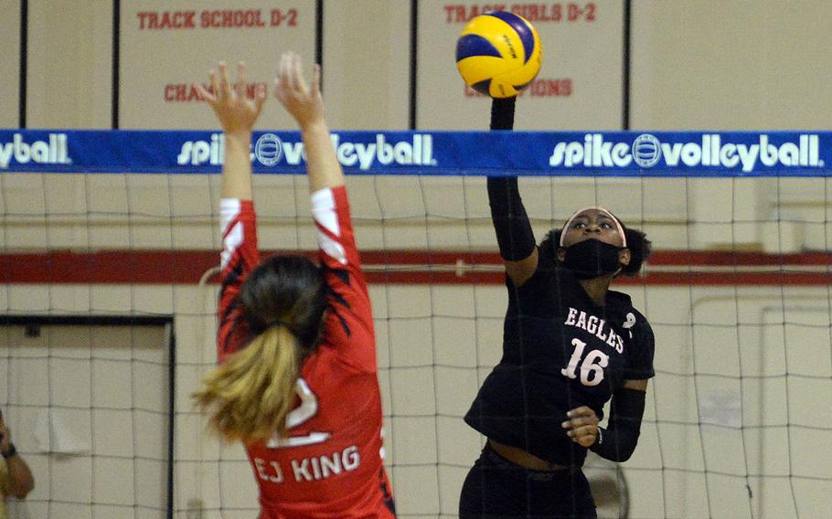 Robert D. Edgren's Jaylie Johnson rifles a spike past E.J. King's Kathryn Kindt during Friday's DODEA-Japan volleyball match. The Eagles won in straight sets in a battle of teams that entered the weekend unbeaten without dropping a set.