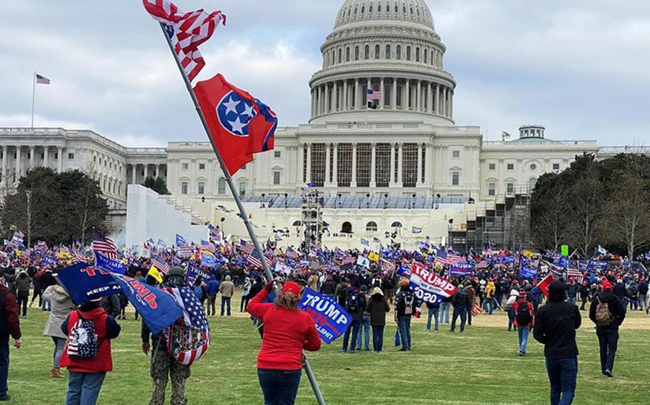Supporters of President Donald Trump stand outside the U.S. Capitol on Jan. 6, 2021. Although multiple veterans were later charged and sentenced for their roles in the ensuing Capitol riot that day, a new Rand Corp. study found that veterans are less likely than the general American public to hold extremist views.
