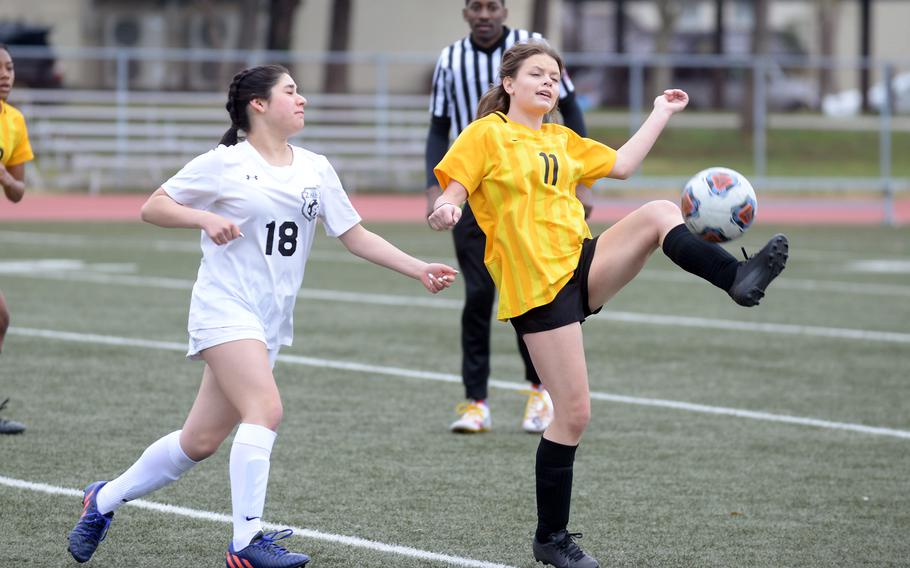 Robert D. Edgren’s Jaideyn Larson tries to settle the ball in front of Zama‘s Olivia Barrios during Saturday’s DODEA-Japan girls soccer match. The Eagles won 3-2.