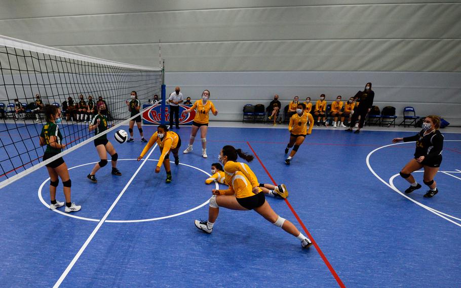 Icsiss Perez of the Stuttgart Panthers dives for the ball during a playoff pool game against the SHAPE Spartans amid the DODEA-Europe Division I Volleyball Tournament at Ramstein Air Base, Germany, Oct. 29, 2021. 