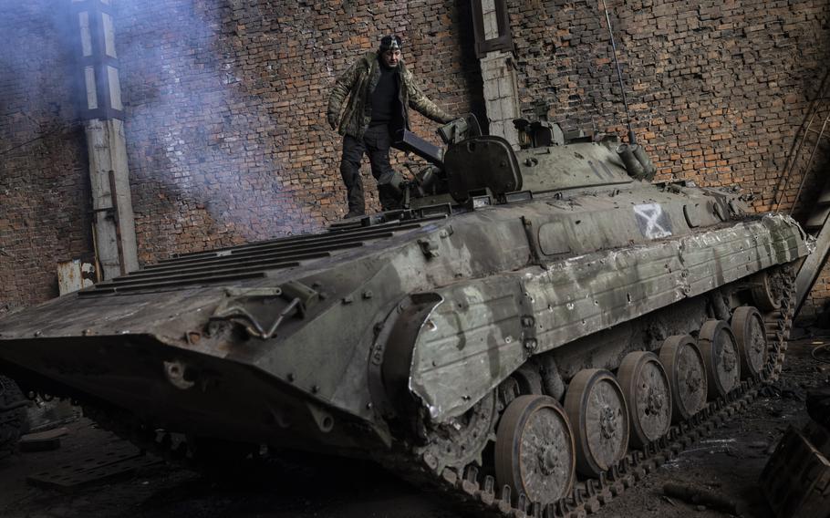 At a field repair site in the Kharkiv region, a maintenance battalion works to repair tanks and armored personnel carriers seized from the Russians, along with some Ukrainian ones. 