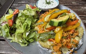 The vegetarian kumpir at Lalé, a Turkish restaurant in Enkenbach-Alsenborn, Germany, is a flattened baked potato topped with grilled veggies and kisir, a bulgur salad.
