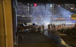 In this image made available by Italian State Police, Italian state police agents attend the scene of a passenger bus accident  near the city of Venice, Italy, that fell from an elevated road, late Tuesday, Oct. 3, 2023, killing at least 21 people near the northern city of Venice. The Venice prefect said that 15 passengers survived.