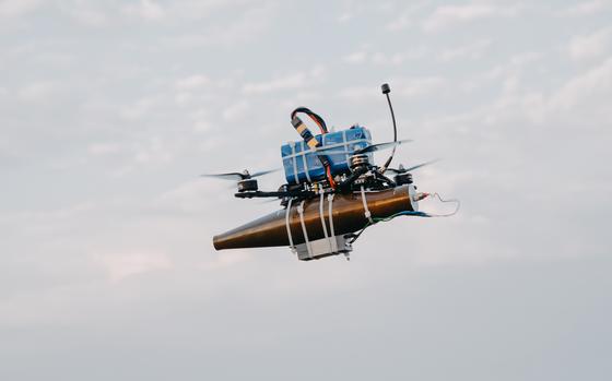 A first-person-view drone with an anti-tank bomb flies from a forward bunker position on the southern front line near Orikhiv, Ukraine, on Sept. 14, 2023. MUST CREDIT: Wojciech Grzedzinski/For The Washington Post