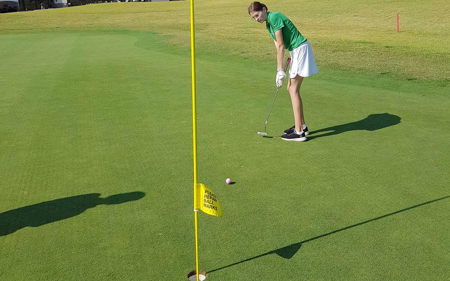 Daegu's Ava Sims holes out on the 18th green to win her match 4 and 3 over Humphreys' Claire Campbell during Thursday's DODEA-Korea golf matches.