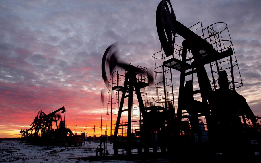 Oil pumping jacks operate in an oilfield near Neftekamsk, in the Republic of Bashkortostan, Russia, on Nov. 19, 2020. MUST CREDIT: Bloomberg photo by Andrey Rudakov.