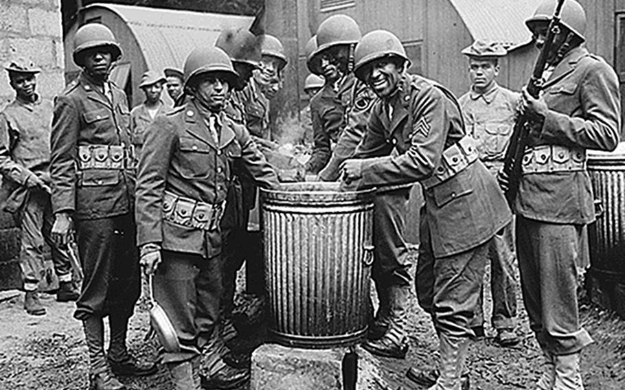 African American soldiers draw rations at the camp cook house at their station in Northern Ireland in 1942. There were a number of racially motivated clashes between Black and white U.S. troops in the United Kingdom during World War II, according to a history pamphlet by retired Air Force officer Alan M. Osur.