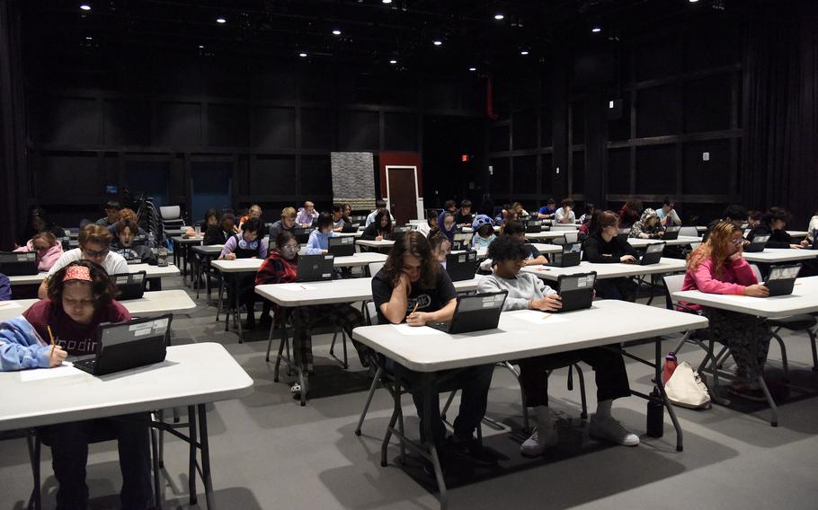 High-schoolers take an electronic version of the Armed Services Vocational Aptitude Battery, or ASVAB, at Yokota Air Base, Japan, Thursday, Nov. 9, 2023.