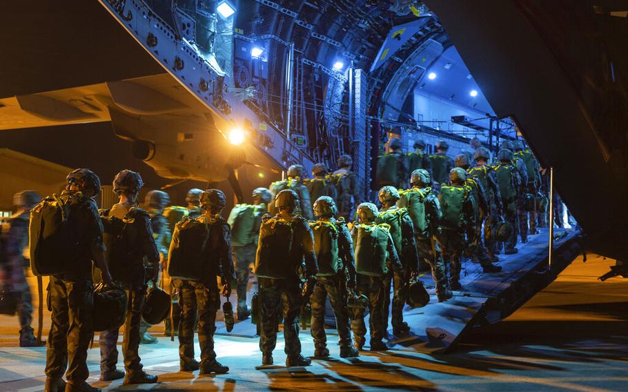 French troops board a military plane in an undisclosed French city to take part to a force projection operation towards Estonia named Operation Thunder Lynx as part of NATO missions in Estonia, early Wednesday June 22, 2022. 