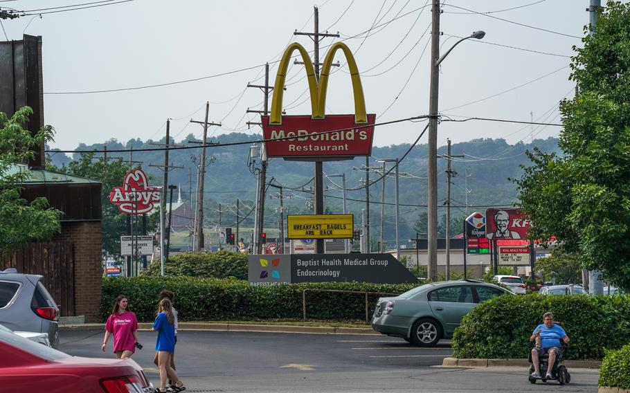 Fast-food restaurants dot a road near a hospital in New Albany, Ind. 