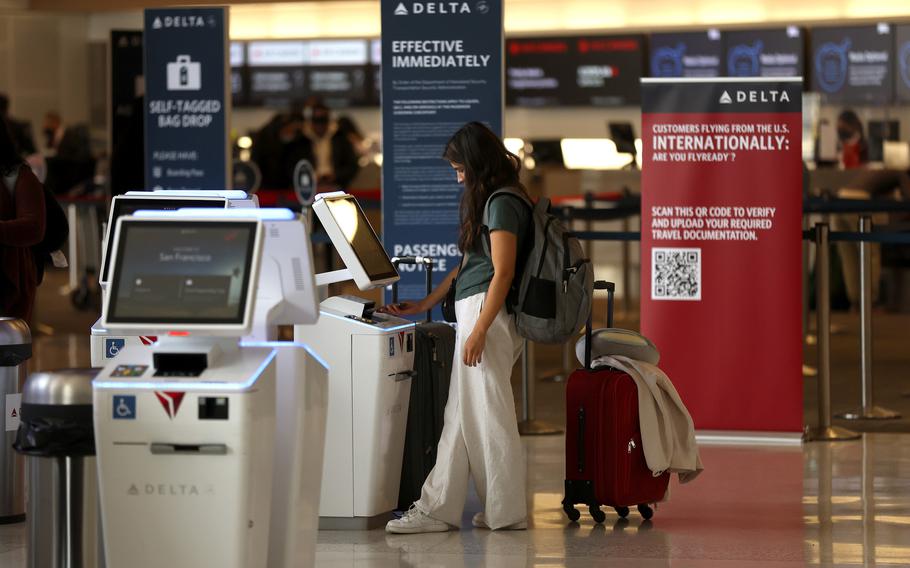 A Delta Airlines customer checks in for a flight at San Francisco International Airport on May 12, 2022 in San Francisco, California. 