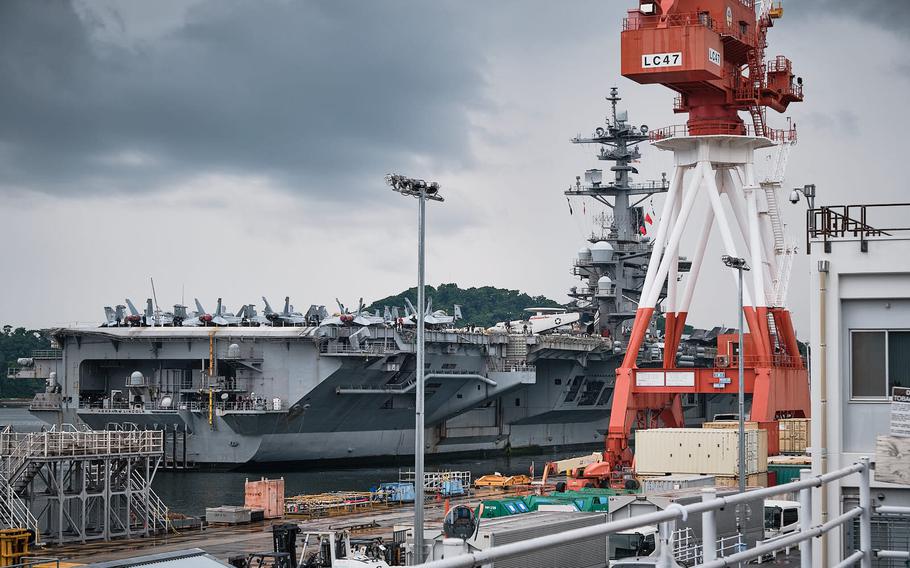 The aircraft carrier USS Abraham Lincoln arrives for a port call at Yokosuka Naval Base, Japan, Saturday, May 21, 2022.