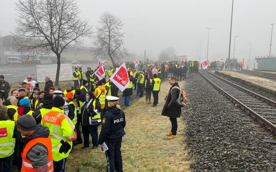 Civilian employees of U.S. bases in Bavaria walked off the job and protested against perceived wage shortfalls in Grafenwoehr, Germany, Tuesday, Feb. 14, 2023. Union representatives estimate 500 workers joined the action to reinforce their demands for pay increases ahead of negotiations scheduled on Feb. 16.