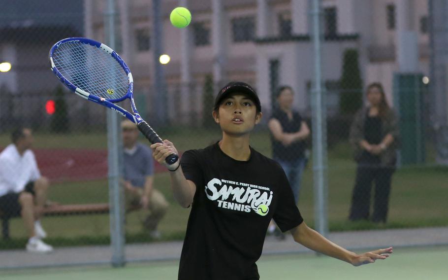 Matthew C. Perry's Aiana Bulan readies a forehand return against E.J. King. Bulan won her singles match and paired with Sasha Malone to win her doubles match.