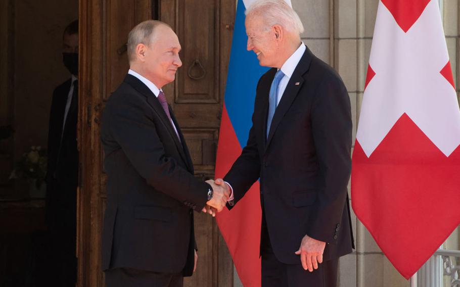 Russian President Vladimir Putin and U.S. President Joe Biden shake hands as they arrive for a U.S.-Russia summit at Villa La Grange in Geneva on June 16, 2021. 