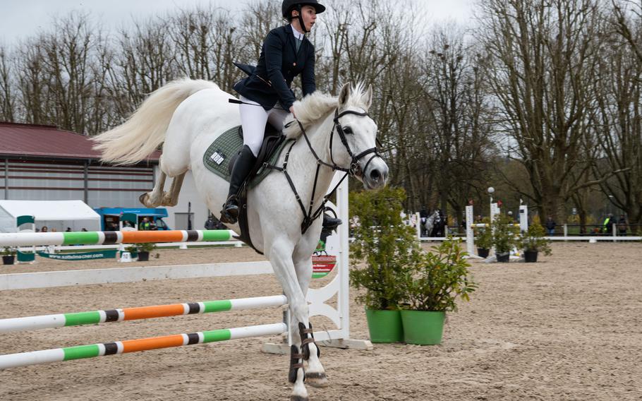 A rider competes at an outdoor jumping tournament at Zweibruecken State Stud, April 16, 2023.