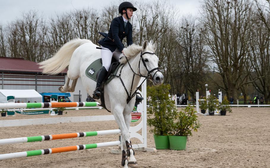 A rider competes at an outdoor jumping tournament at Zweibruecken State Stud, April 16, 2023.