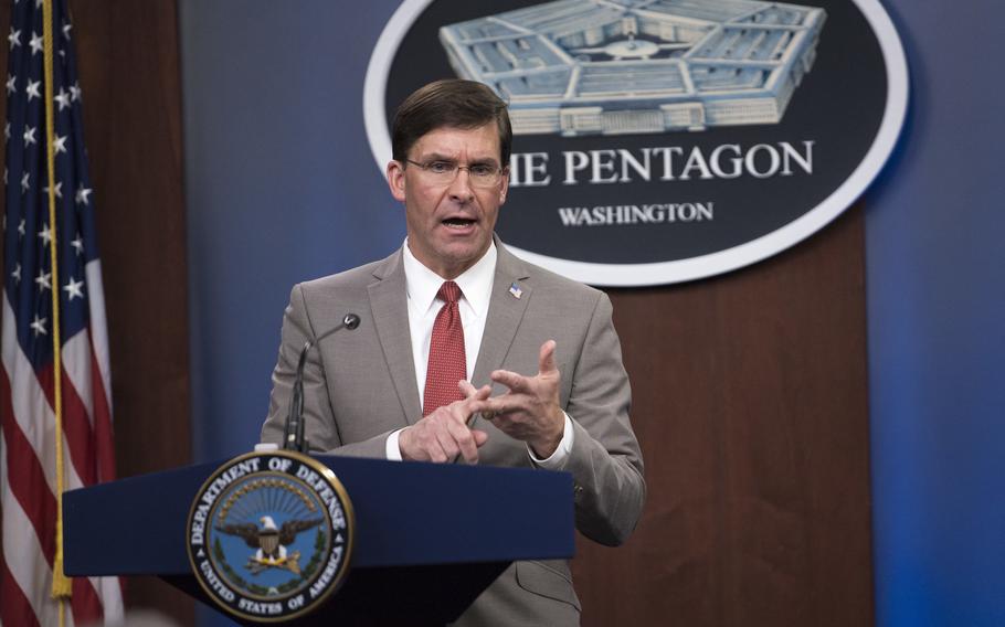 Mark Esper briefs news reporters at the Pentagon on March 17, 2020, when he served as defense secretary. 