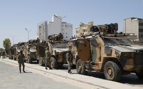 Libyan forces are deployed in Tripoli, Libya, Saturday, Aug. 27, 2022. Clashes broke out early Saturday between rival militias in Libya's capital, a health official said. (AP Photo/Yousef Murad)