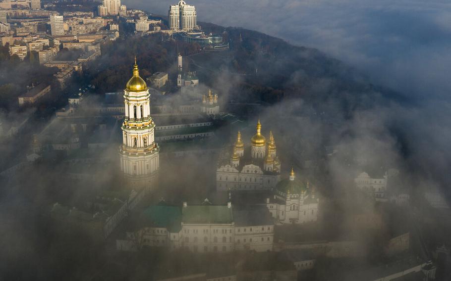 The thousand-year-old Monastery of Caves, also known as Kiev Pechersk Lavra, the holiest site of Eastern Orthodox Christians is seen through morning fog during a sunrise in Kyiv, Ukraine, on Nov. 10, 2018. 