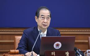 South Korea’s Han Duck-soo speaks during a cabinet meeting.