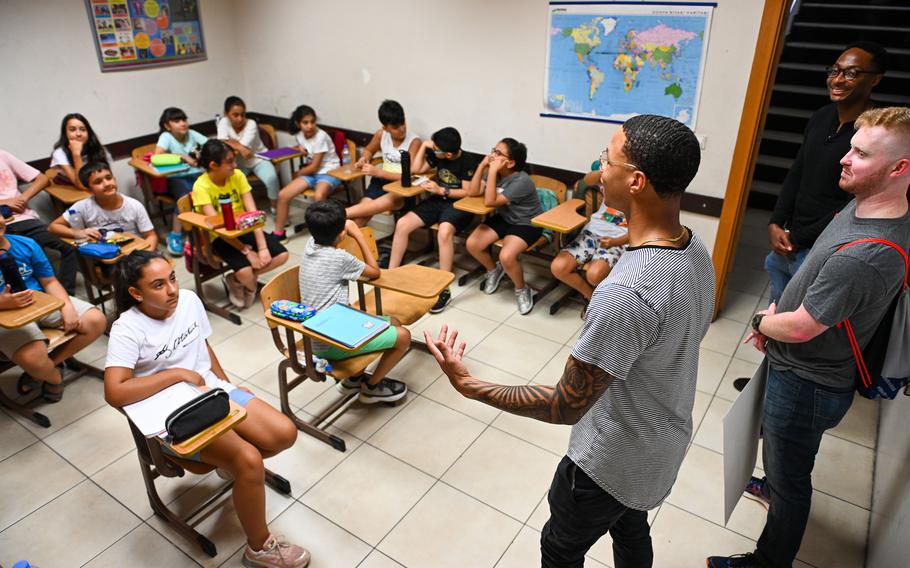 Airmen stationed at Incirlik Air Base in Turkey speak with Turkish-American Association students in Adana, Turkey, on Aug. 23, 2022. The airmen began visiting the association last year to help students with their English lessons and enhance cultural ties. After a pause in visits following the February earthquakes that struck Turkey and Syria, they are planning to renew the partnership in June.