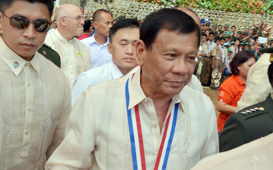 Then-Philippine President Rodrigo Duterte arrives at Mount Samat to commemorate the 75th anniversary of the fall of the Bataan Peninsula to Japanese forces during World War II,  April 9, 2017.