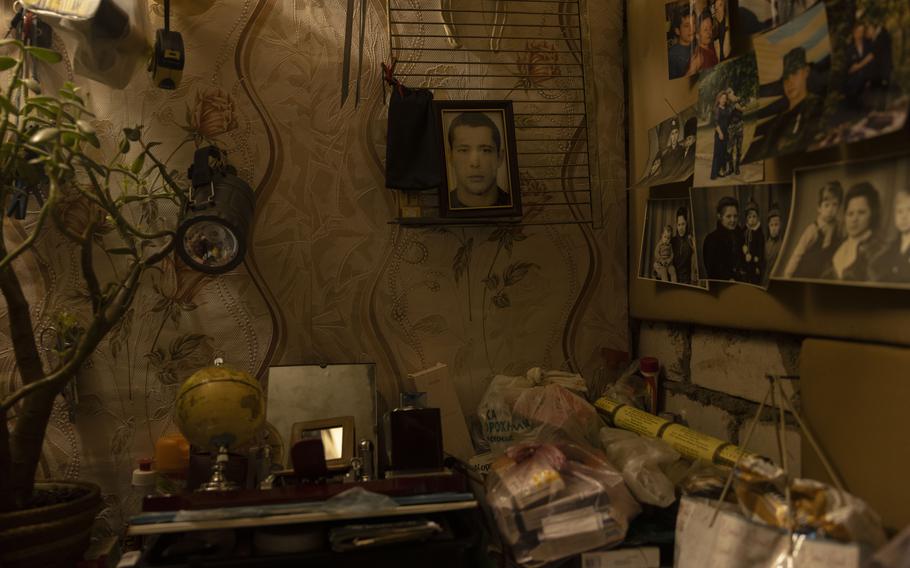 Surzhon’s makeshift bedroom is decorated with family photographs, including a picture of her late son, Pavlo.