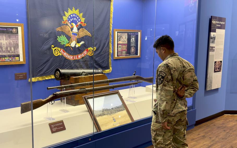 A soldier checks out a display inside the newly renovated 2nd Infantry Division, Eighth Army and Korean Theater of Operations Museum at Camp Humphreys, South Korea, Oct. 19, 2022.
