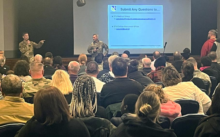 Col. Andrew Roddan, left, commander of the 374th Airlift Wing, and Dr. Michael Brough, a colonel in charge of the 374th Medical Group, take questions about civilian health care at Yokota Air Base, Japan, Thursday, Jan. 5, 2023. 