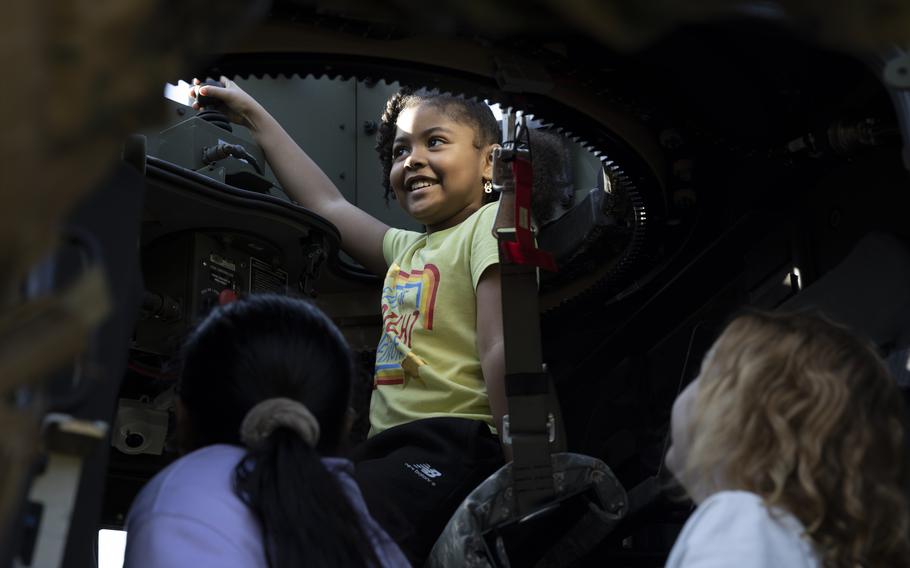 Students at Oaks Road Academy explore the inside of a Joint Light Tactical Vehicle during a career fair in New Bern, N.C., on Friday, April 19, 2024. 