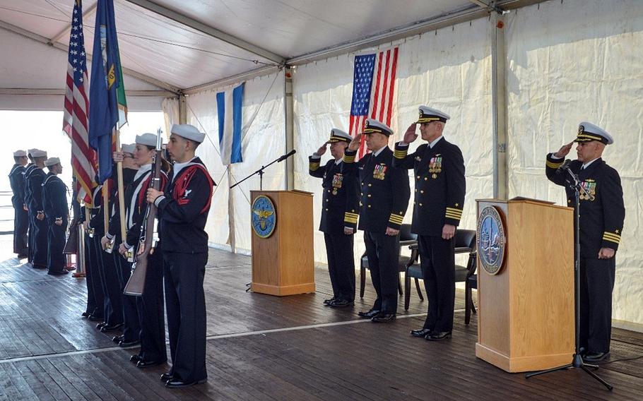 U.S. 6th Fleet commander Vice Adm. Thomas Ishee joins Capt. Daniel Prochazka, the outgoing commanding officer of the USS Mount Whitney, and Capt. Matthew Kiser, the incoming commander, back row from left, at a ceremony April 11, 2023, in Gaeta, Italy.