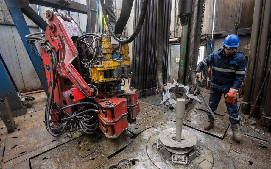 A worker monitors drilling procedures at a gas drilling rig on the Gazprom Chayandinskoye oil, gas and condensate field in the Lensk district of the Sakha Republic, Russia, on Oct. 13, 2021. 