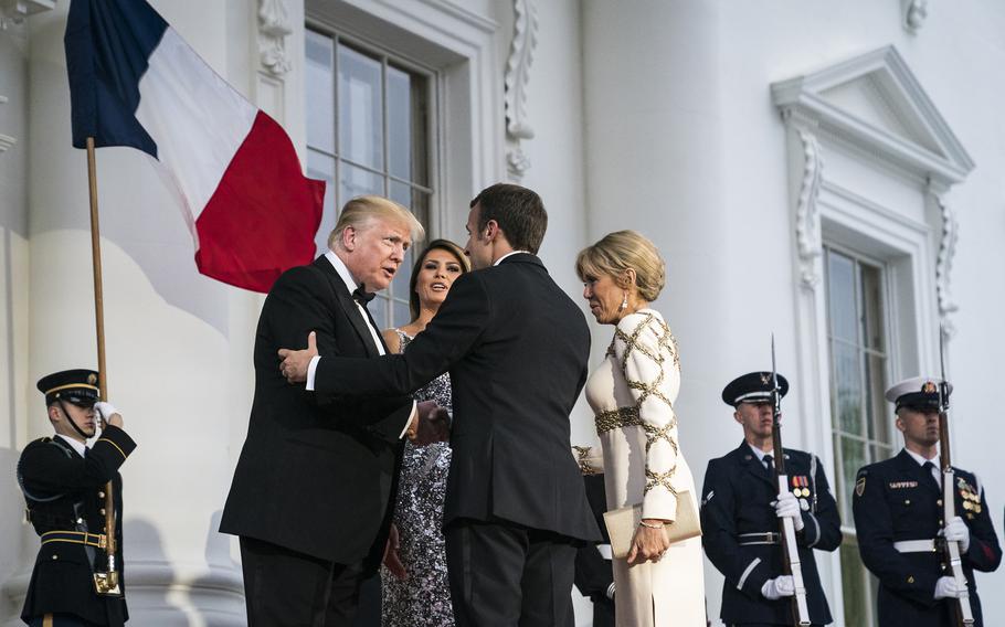 During the French president’s visit in 2018, President Donald Trump welcomed Emmanuel Macron to the Oval Office by brushing what he called a “little piece of dandruff” off Macron’s shoulder. 