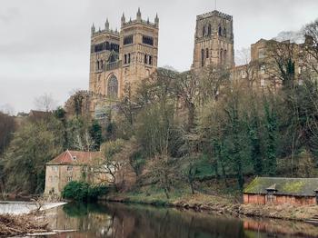 Durham River on cloudy day with the Cathedral and trees in the background