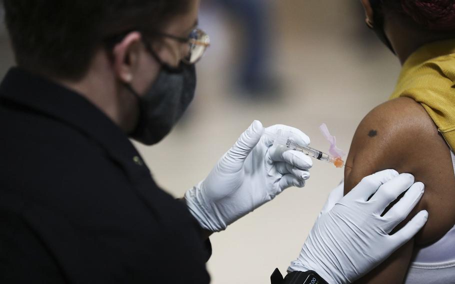 A person is administered a dose of the Johnson & Johnson COVID-19 vaccine at a city mass vaccination clinic at the Salvation Army at 55th and Market in West Philadelphia on March 26, 2021. 