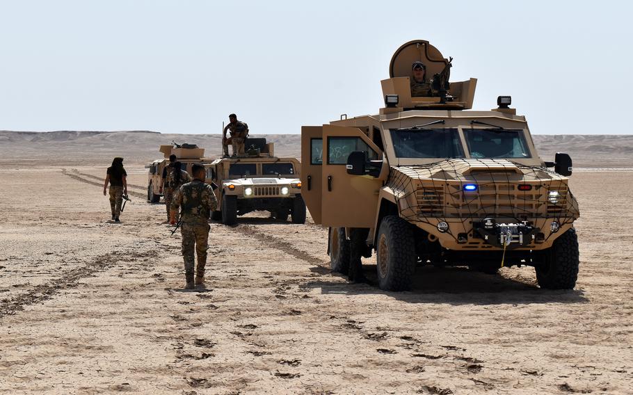 Syrian Democratic Forces conduct a patrol during a joint operation with U.S. soldiers in Syria on May 8, 2021. Seven years after the Islamic State group swept through parts of Syria and Iraq, ISIS it remains a threat, but hasn't been able to mount any deliberate attacks on coalition forces in more than two years, the U.S. military said.