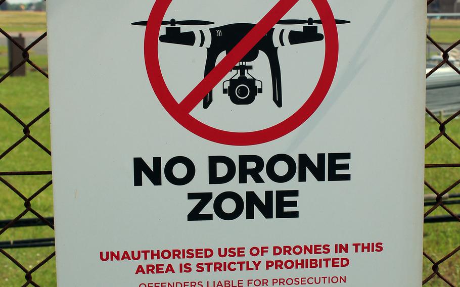 A sign posted on a perimeter fence at RAF Mildenhall in England bars the flying of drones over the base, which is home to the U.S. Air Force's 100th Air Refueling Wing.  