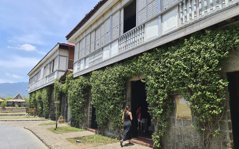 Shaina Renee Manlangit entering the historic resort, Las Casas Filipinas de Acuzar, in Bagac, Bataan in the Philippines March 2023. The Philippines has long been interested in attracting Filipinos in the U.S. to come and add to the economy, but its incentives have mostly drawn retirees or immigrants catching up with relatives. Today, they are honing in on young Filipino American professionals who live on TikTok and Instagram. 