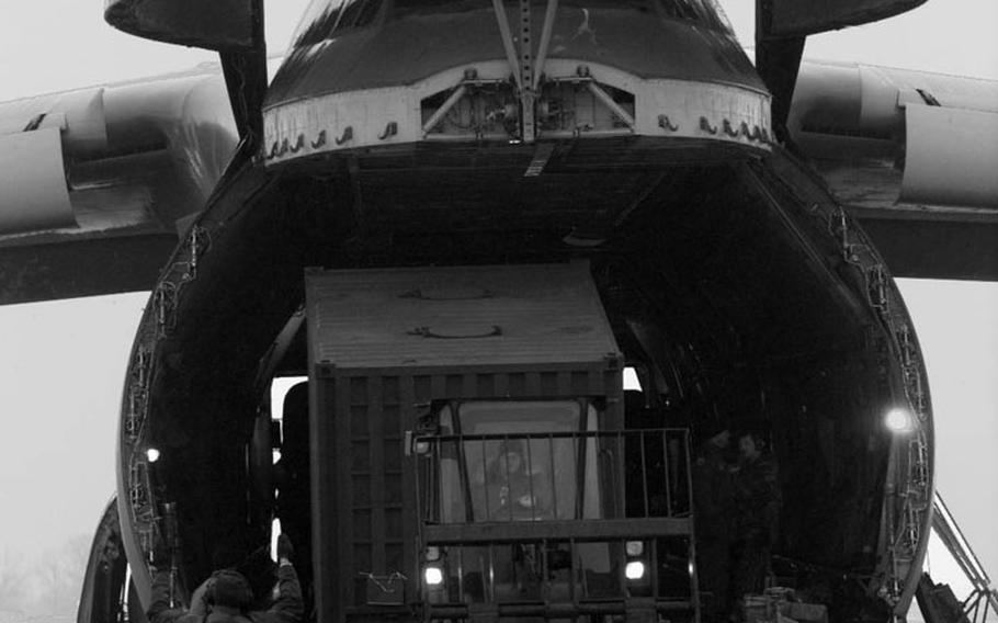 Taszar AB, Hungary, January, 1996: Air Force personnel at Taszar AB offload another cargo plane during the massive airlift that occured at the beginning of Operation Joint Endeavor.