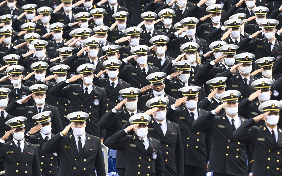 Midshipmen salute during the national anthem before a football game against Houston at Navy-Marine Corps Memorial Stadium in Annapolis in 2020.